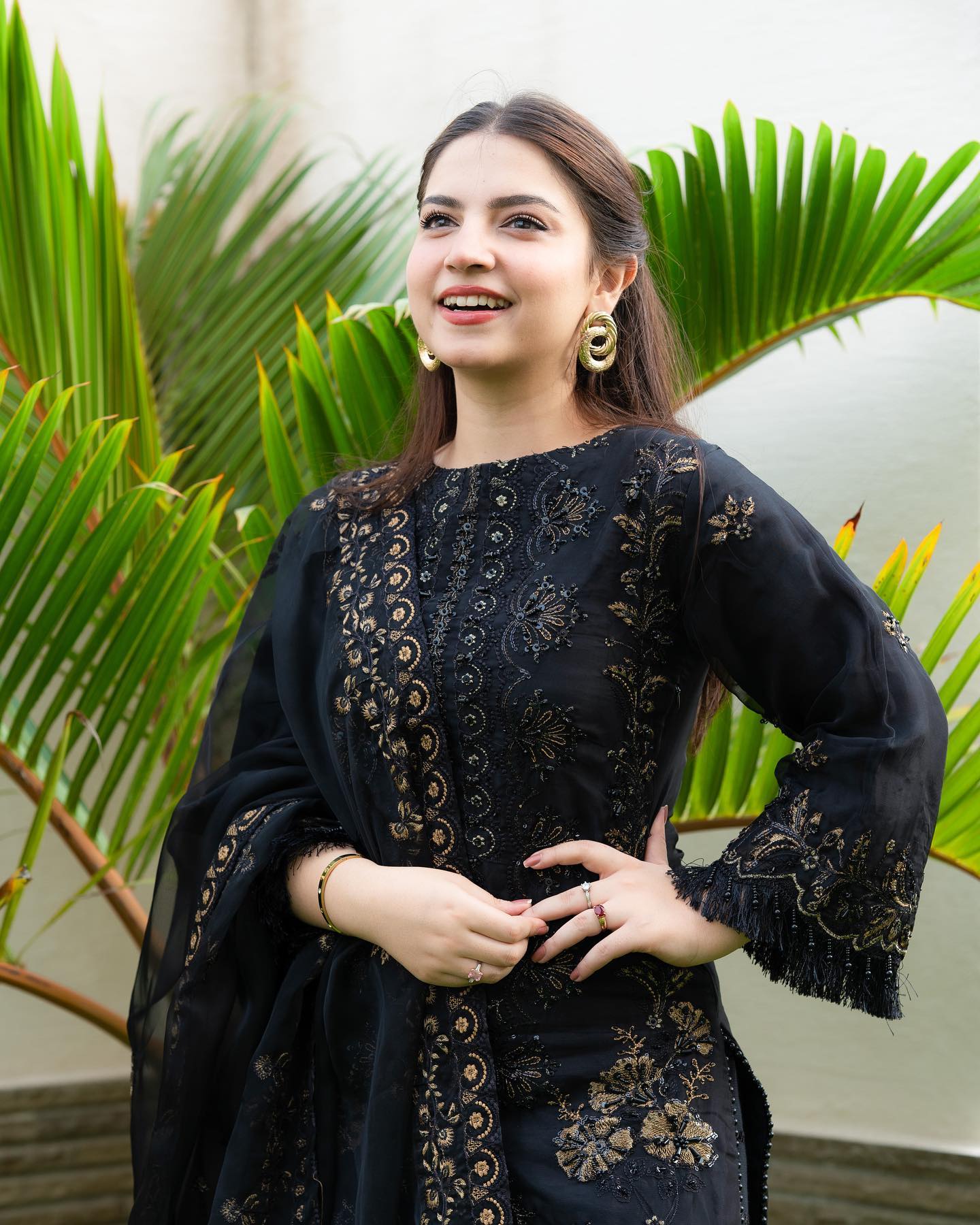 Pakistani model Dana Neer in a black designer dress with gold embroidery