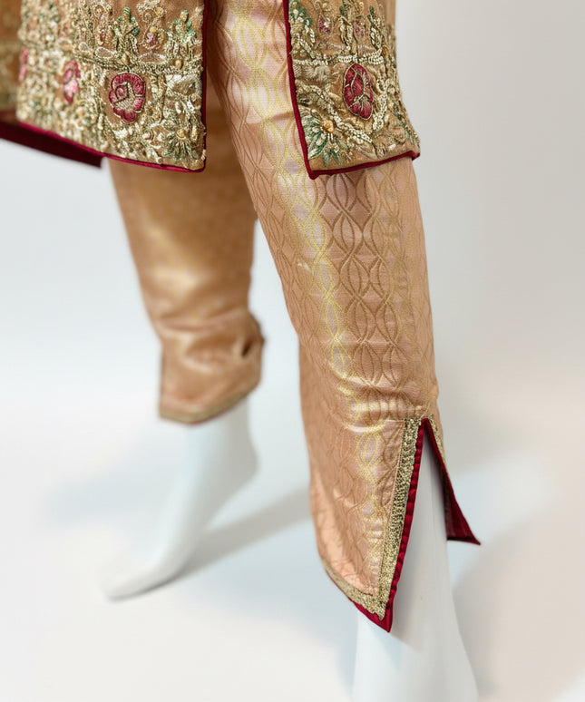 Traditional outfit with embroidered top and pants on a white background