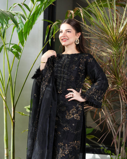 Pakistani model Dana Neer in a black designer dress with a black dupatta