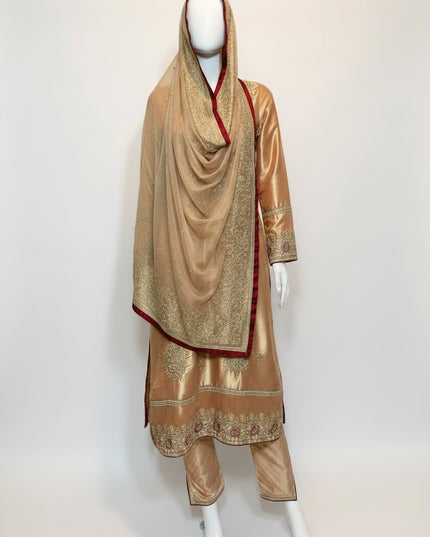 Traditional outfit with embroidered gold dress and matching dupatta on a mannequin against a white background