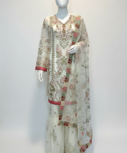 Floral embroidered outfit on a mannequin against a plain background