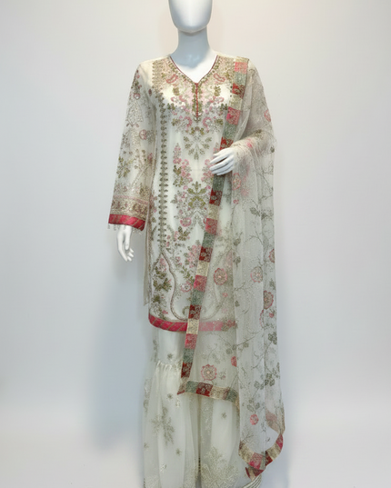 Floral embroidered outfit on a mannequin against a plain background