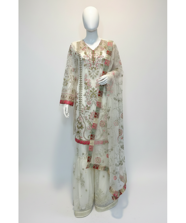 Floral embroidered outfit on a mannequin against a plain background