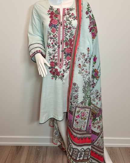Mannequin wearing a light blue embroidered outfit with a matching dupatta on a plain background