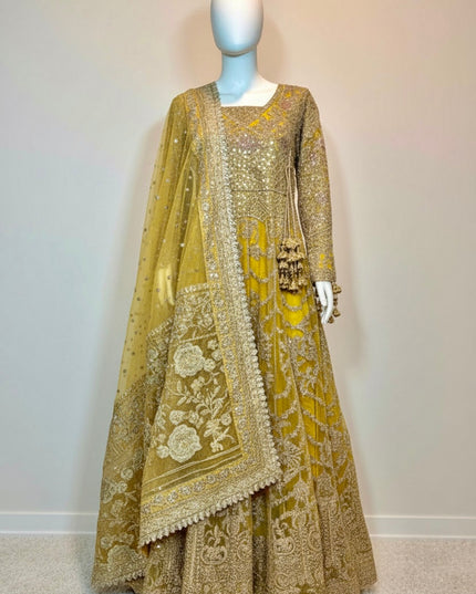 Traditional embroidered outfit on a mannequin against a plain background