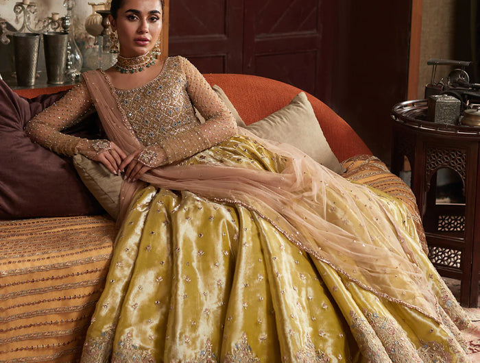 Model in a yellow Faiza Saqlain silk suit
